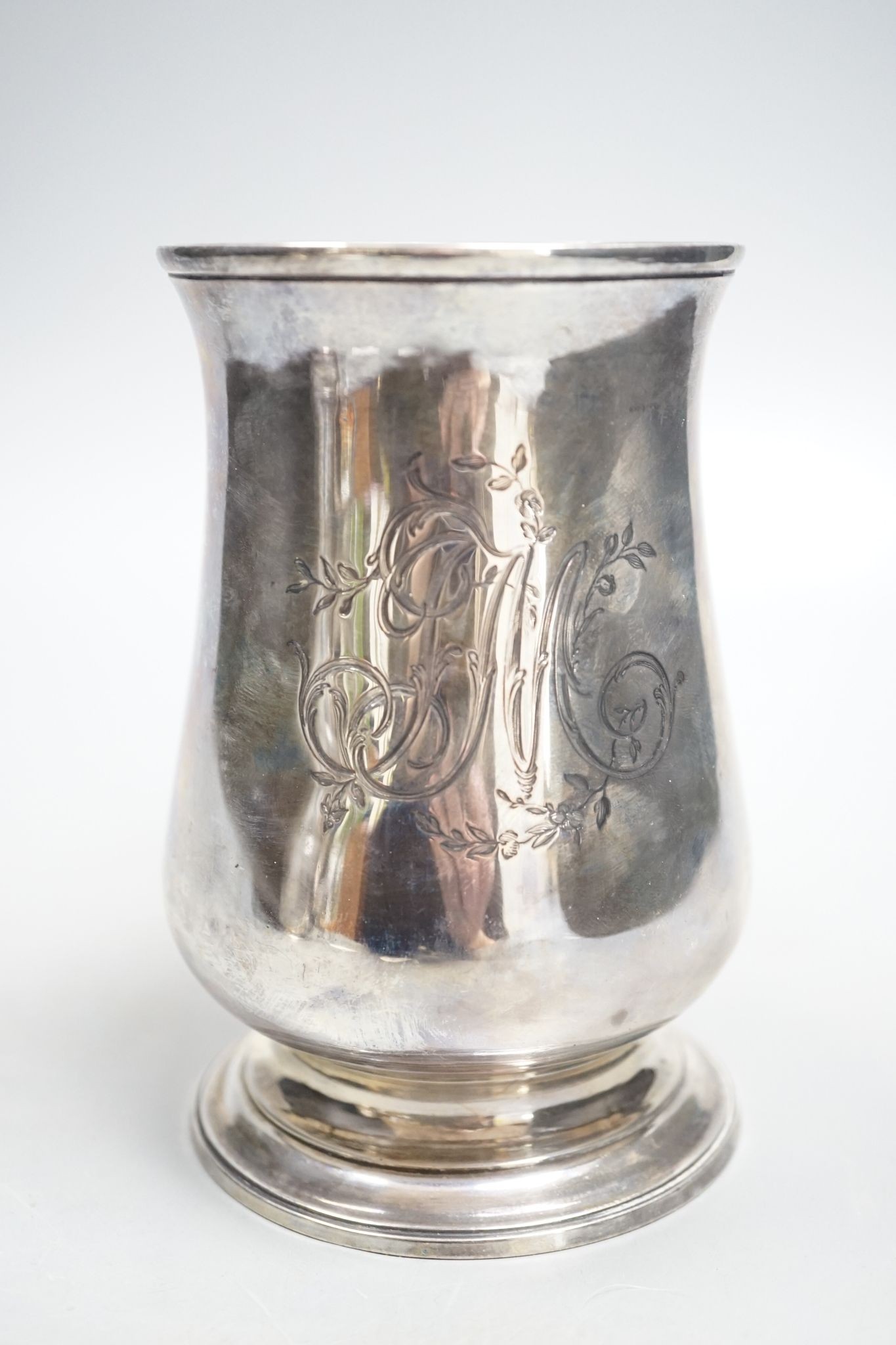 A George III silver baluster mug, with later engraved monogram, John Chapman II, London, 1773, 13.6cm, 14oz.